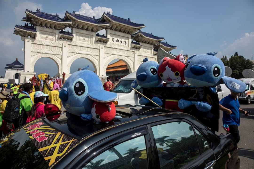 近年宮廟遶境活動中常見的動畫公仔,也出現在凱道隊伍中。