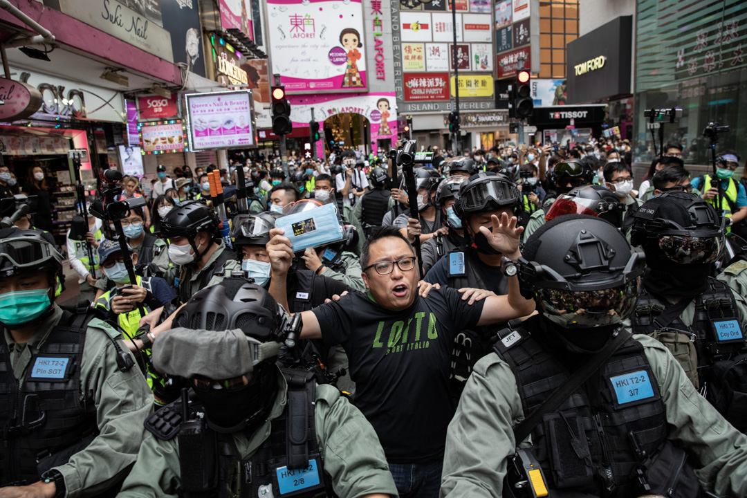 2020年5月24日，市民在香港岛一带发起反对国安法及国歌法游行，人民力量副主席谭得志被捕。摄：陈焯煇/端传媒