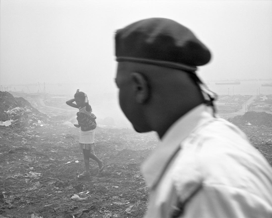 Jo Ractliffe (South African, born 1961)
Woman and her baby, Roque Santeiro market, 2007
From the series Terreno Ocupado
Inkjet print, 2015
On loan from the artist, courtesy Stevenson, Cape Town and Johannesburg © Jo Ractliffe. Courtesy of Stevenson, Cape Town and Johannesburg